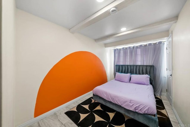 bedroom featuring beamed ceiling