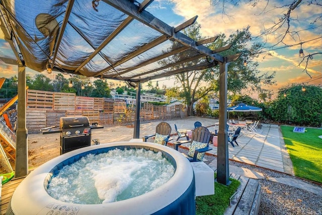 pool at dusk featuring area for grilling, a jacuzzi, and a pergola