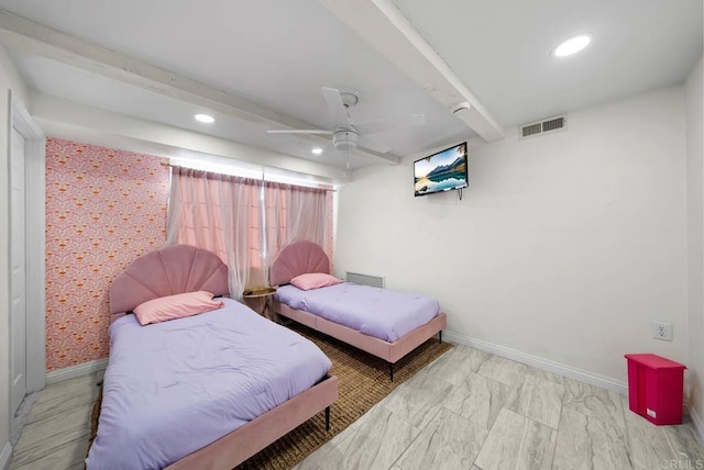 bedroom with beamed ceiling and ceiling fan