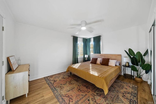 bedroom featuring ceiling fan and hardwood / wood-style floors