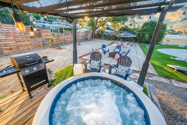 pool at dusk with a pergola, a grill, and a fire pit