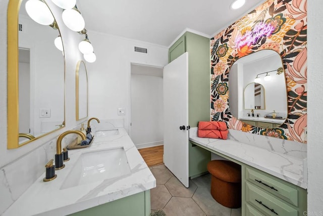 bathroom with tile patterned flooring, vanity, and crown molding