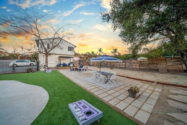 patio terrace at dusk with a lawn