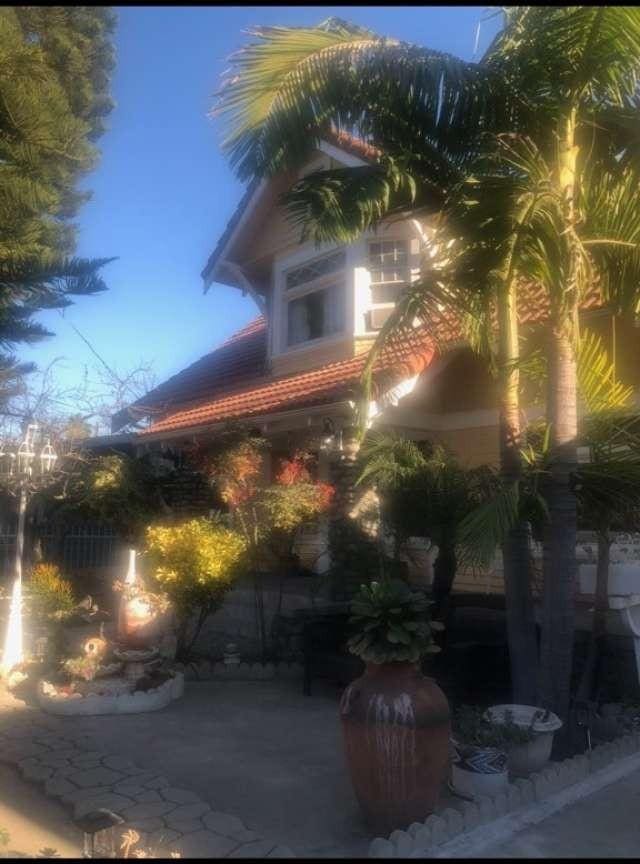 property exterior at dusk with a patio