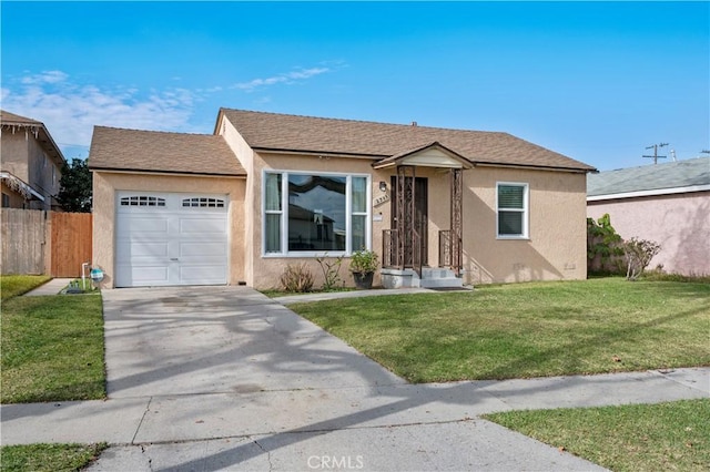 view of front of house featuring a garage and a front lawn