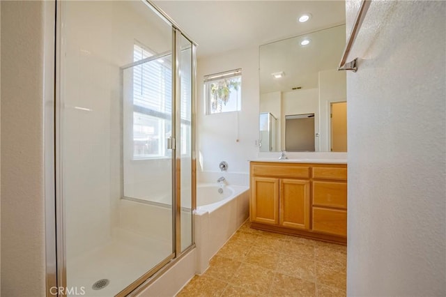 bathroom with vanity and plus walk in shower