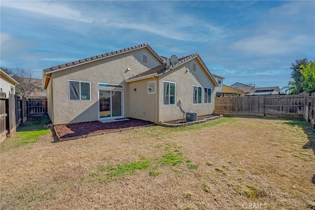 rear view of property with a lawn