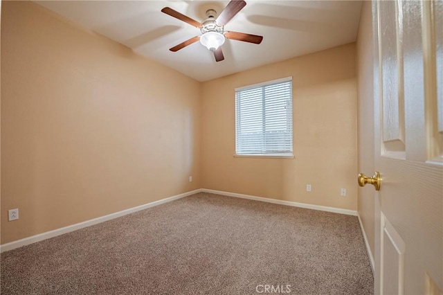 spare room with ceiling fan and carpet flooring