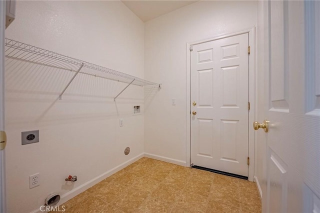 clothes washing area featuring hookup for a washing machine, gas dryer hookup, and electric dryer hookup