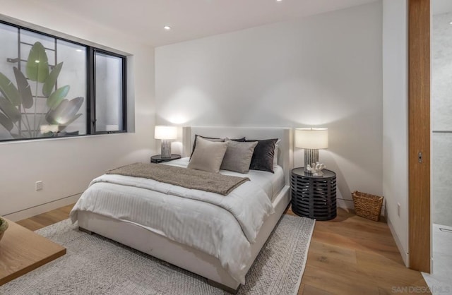 bedroom with light wood-type flooring