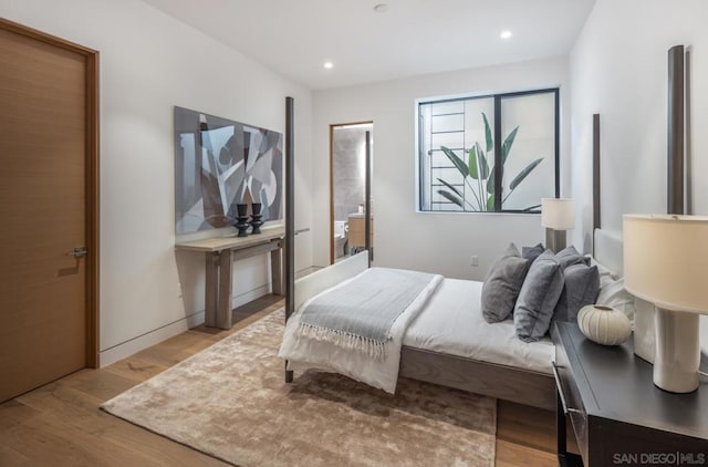 bedroom with light hardwood / wood-style floors