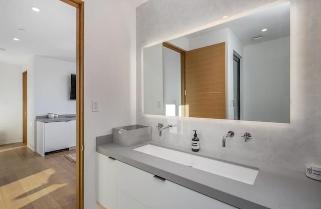 bathroom featuring vanity and hardwood / wood-style floors