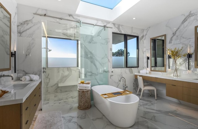 bathroom with vanity, a skylight, a wealth of natural light, and plus walk in shower