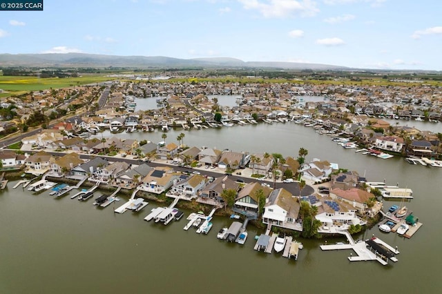 bird's eye view with a water and mountain view