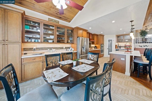 dining space featuring light parquet floors, lofted ceiling, wood ceiling, and ceiling fan