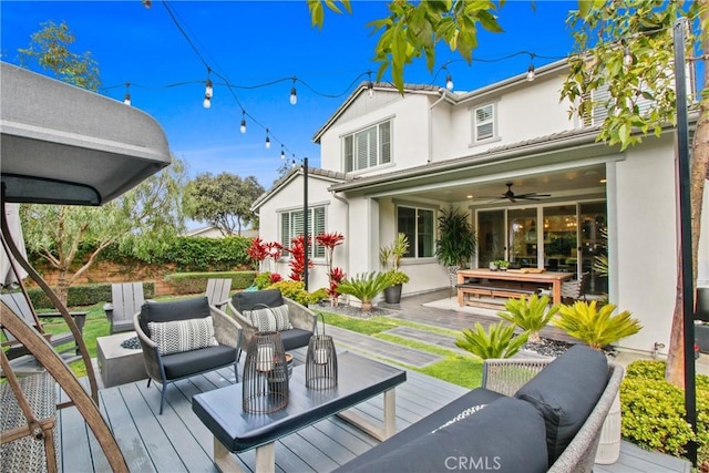 deck featuring an outdoor hangout area and ceiling fan