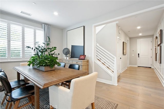 dining area featuring light wood-type flooring