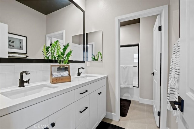 bathroom with vanity, tile patterned floors, and decorative backsplash