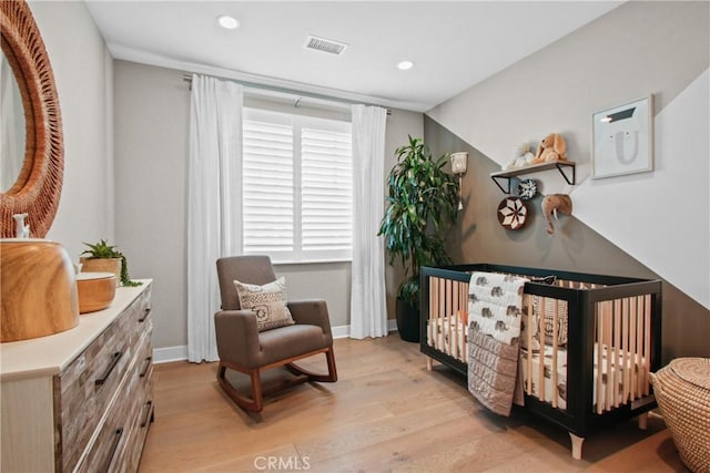 sitting room featuring light hardwood / wood-style floors