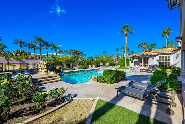 view of pool featuring a patio