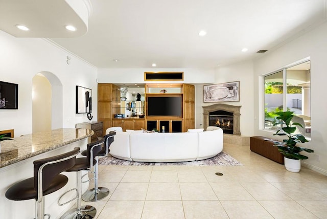 tiled living room with ornamental molding