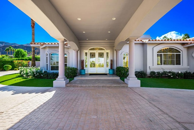 doorway to property featuring a mountain view and french doors