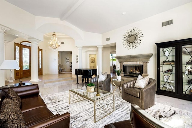 living room with beamed ceiling, a fireplace, high vaulted ceiling, and ornate columns