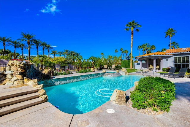 view of pool featuring a patio area