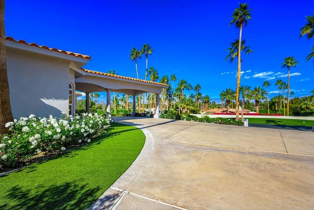 view of home's community with a lawn