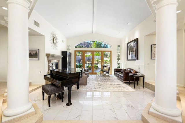 miscellaneous room with ornate columns, vaulted ceiling, and french doors