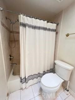 full bath with toilet, tile patterned flooring, and shower / bathtub combination with curtain