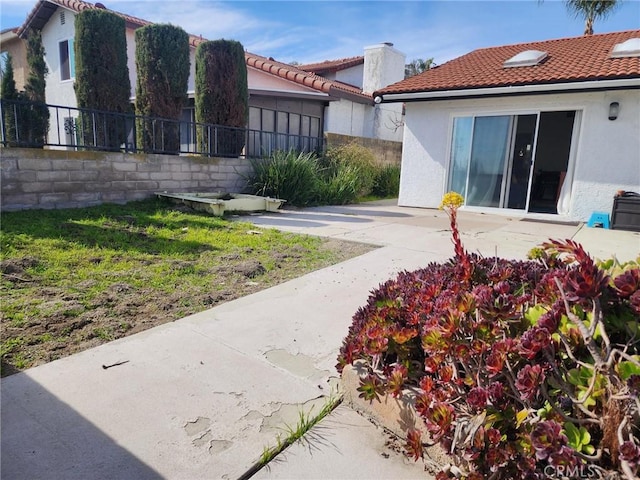 view of yard featuring fence and a patio area