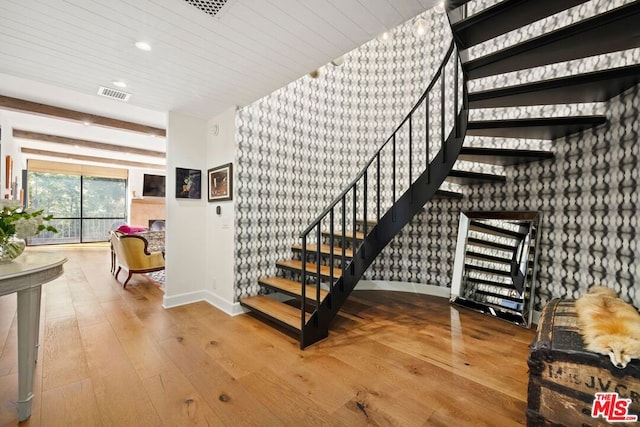 stairs with hardwood / wood-style floors