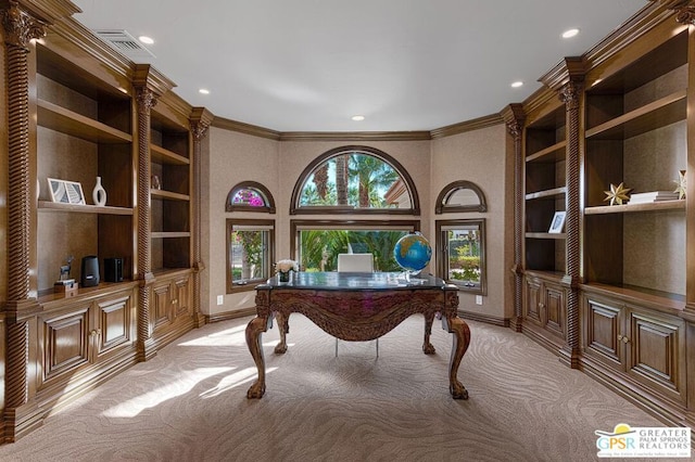 office area featuring light carpet, built in shelves, and ornamental molding