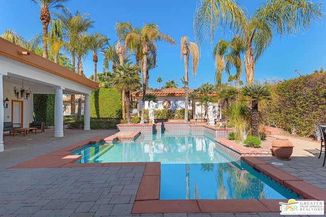 view of swimming pool with a patio area