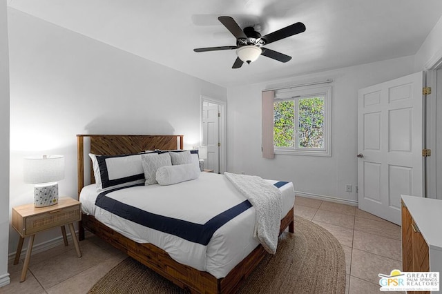 tiled bedroom with ceiling fan