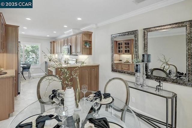 dining area featuring ornamental molding