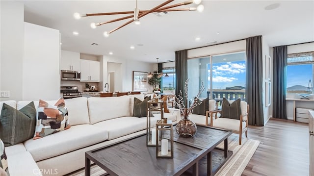16650 Crocus Ln Unit 1, Fontana, CA 92336 - living area featuring a chandelier, light wood finished floors, and recessed lighting