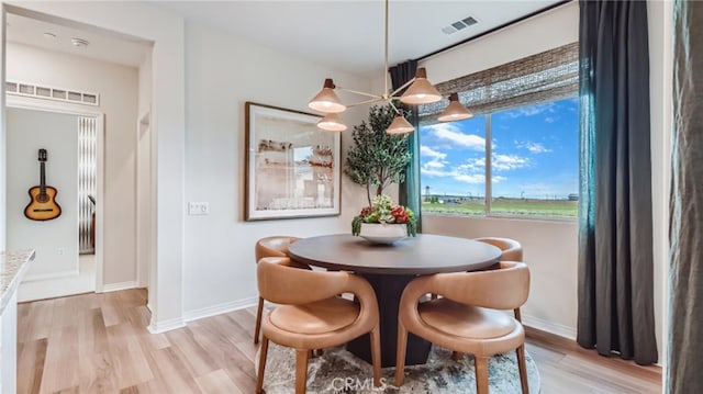 dining space with light wood-type flooring