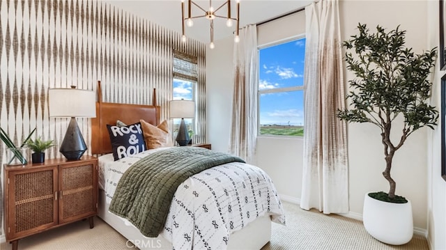 16650 Crocus Ln Unit 1, Fontana, CA 92336 - carpeted bedroom with baseboards and a chandelier
