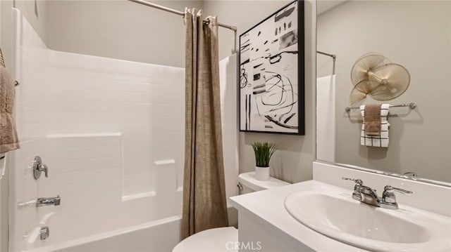 full bathroom featuring vanity, shower / bathtub combination with curtain, and toilet