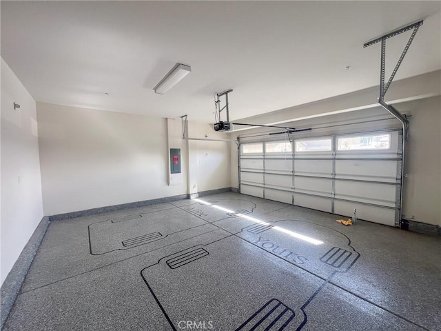 garage with a garage door opener and electric panel