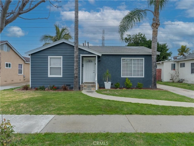 view of front of home with a front yard