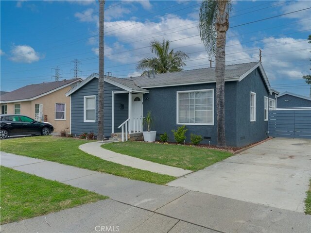 single story home featuring crawl space, concrete driveway, a front yard, and stucco siding