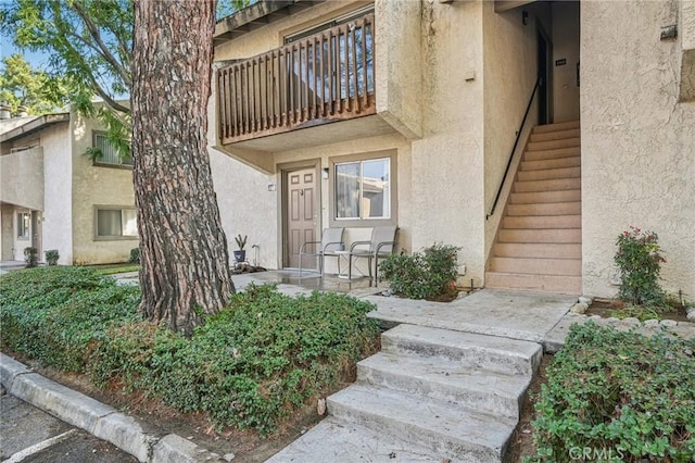 property entrance with a balcony