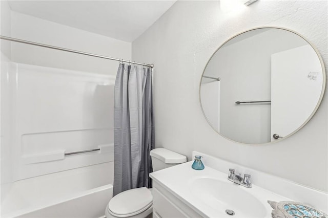 full bathroom with vanity, shower / bath combination with curtain, and toilet