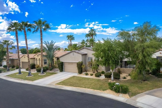 view of front of property with a garage and a front yard