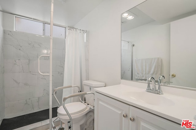 bathroom with vanity, toilet, and walk in shower