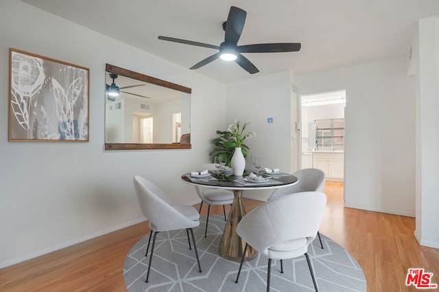 dining area featuring light wood-type flooring