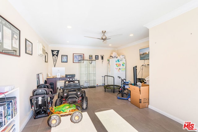 exercise room featuring crown molding and ceiling fan